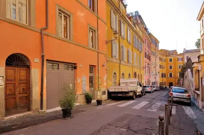 a street with buildings and a truck parked on the street at Appartamento Sforza a Monti in Rome