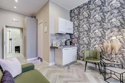 a living room with a kitchen and a living room at Hanky Suite in Rome