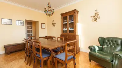a dining room with a table and chairs at Rental in Rome Risorgimento view Aparment in Rome