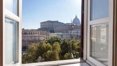 an open window with a view of a city at Rental in Rome Risorgimento view Aparment in Rome
