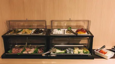 three trays of food sitting on a table at Domus Helena in Rome