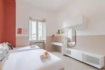 a white room with two beds and a sink at BLAM Alice's House, Great view to Santa Maria Maggiore Church in Rome