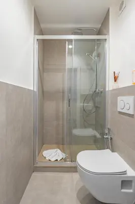 a bathroom with a sink and a toilet and a shower at BLAM Alice's House, Great view to Santa Maria Maggiore Church in Rome