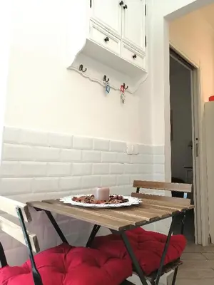 a table with a candle on it in a kitchen at Sivory Rome in Rome
