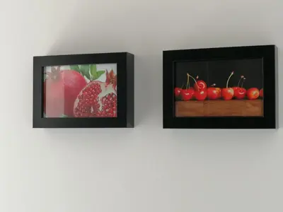 two pictures of strawberries and cherries on a wall at Sivory Rome in Rome
