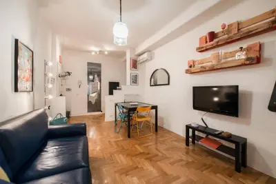 a living room with a couch and a table at Modern Living San Paolo - Vicino alla Metro in Rome