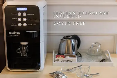 a coffee machine sitting on top of a counter at Navona Central Suites in Rome