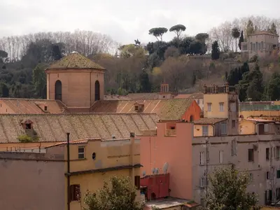 a view of a city with buildings and a church at Over The Tiber Loft in Rome
