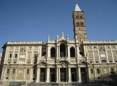 a large building with a clock tower on top of it at Granny's House Colosseum in Rome