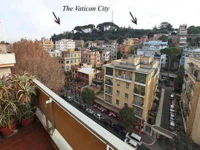 a view of a city from the balcony of a building at Angelo Emo Home in Rome