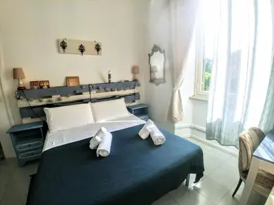 a bedroom with a bed with towels on it at B&B Next Stop in Rome