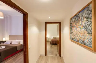 a bedroom with a bed and a large painting on the wall at B&B Gallia's Rooms in Rome