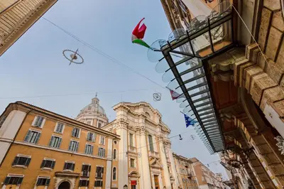 a group of buildings with kites flying in the sky at TownHouse by the Spanish Steps in Rome