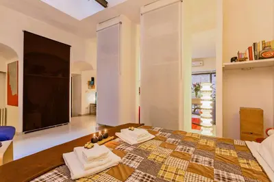 a bedroom with a bed with towels on it at Rome as you feel - Selci Apartment in Rome