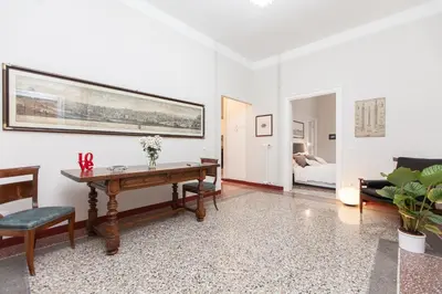 a living room with a table and a couch at Lovely House Rome in Rome