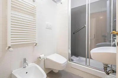 a bathroom with a toilet and a sink and a shower at Domus Castrense in Rome