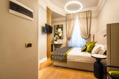 a bedroom with a bed and a window at MyBedCavour in Rome
