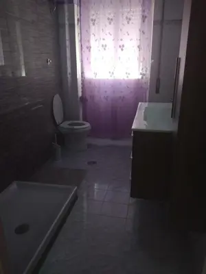 a bathroom with a toilet and a sink and a window at Dal Pontefice in Rome