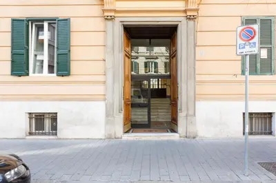 a door to a building with green shutters at Domus Terenzio in Rome