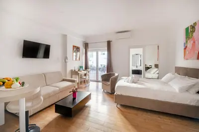a living room with a couch and a table at HOME SWEET HOLIDAY srl in Rome
