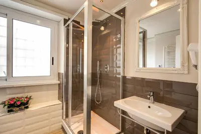a bathroom with a sink and a shower at Casa Mia Vaticano Guest House in Rome