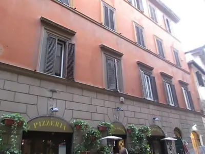 a building with windows and plants on the side of it at Trevi Elegance Suite in Rome