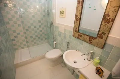 a bathroom with a sink and a toilet and a mirror at Giubiliana in Rome
