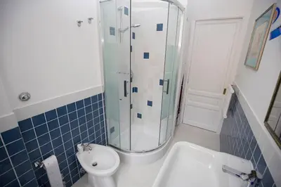 a bathroom with a shower and a toilet and a sink at Giubiliana in Rome