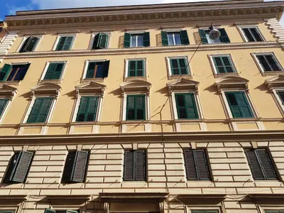 a large building with many windows on it at 3 Lati di Pitagora B&B in Rome