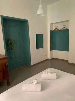 two towels sitting on top of a bed in a room at Mc - Piazza Mancini in Rome