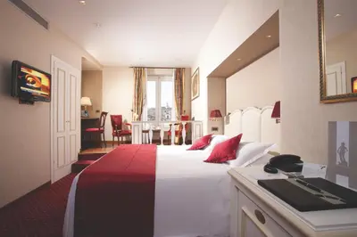 a hotel room with a bed with a phone on it at Hotel Nazionale in Rome