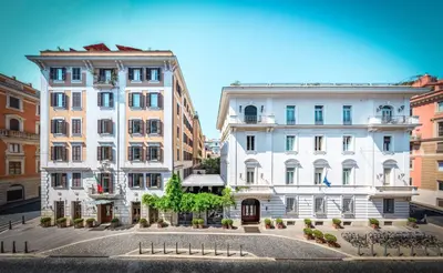 a view of two buildings in a city at Hotel Locarno in Rome