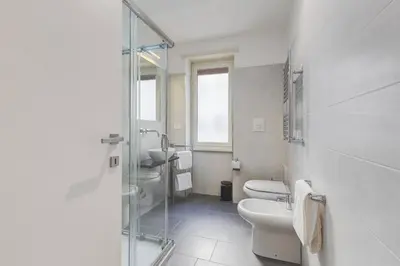 a bathroom with a toilet and a glass shower at AV Domus Vatican St.Peter B&B in Rome