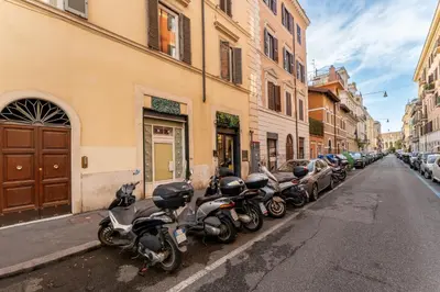 a row of motorcycles parked on the side of a street at About Colosseo - Appartamento al Colosseo nel cuore di Roma - Free WiFi in Rome