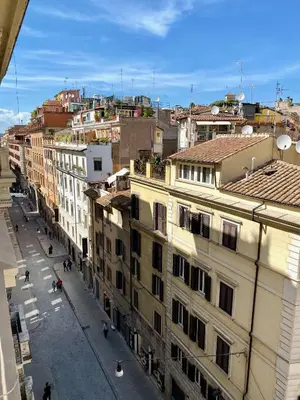 an overhead view of a city street with buildings at Spain Apartments in Rome