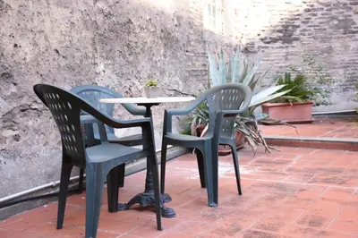 two chairs and a table on a patio at Agrippa's Terrace in Rome