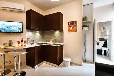 a kitchen with a sink and a counter top at Guest House Grazioli in Rome