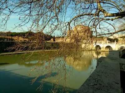 a view of a river with a bridge at Fotofever Apt, two bedrooms with air conditioned in elegant shopping area, close to Vatican City in Rome