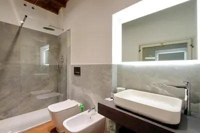 a bathroom with a sink and a toilet and a mirror at YCH-Farnese Charme in Rome