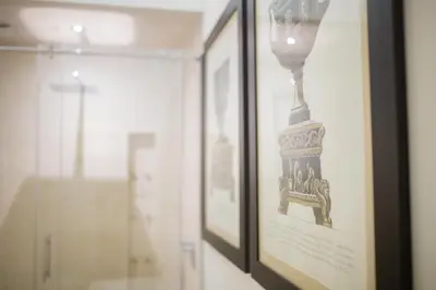 a picture of a clock in a frame on a wall at StarHome Pantheon in Rome