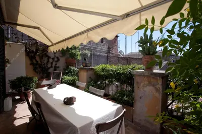 a white table with a cat sitting on top of it at Terrace Jewel by Campo de Fiori in Rome