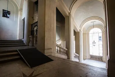 an empty hallway of a building with a large window at Altieri Loft Pantheon in Rome