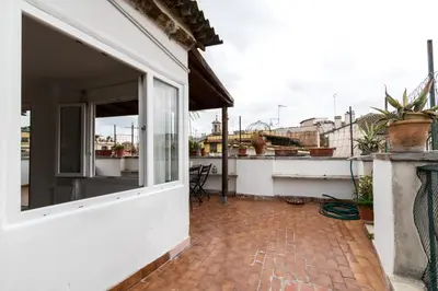 a balcony of a house with a window at Tetti di Piazza Navona in Rome