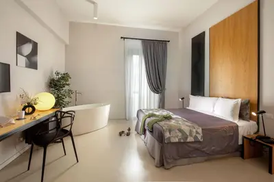 a hotel room with a bed and a desk at Viminale View Hotel in Rome