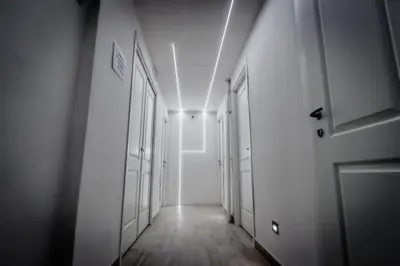 a hallway with a white door and a hallway with white walls at Mr. Charlie Brown in Rome