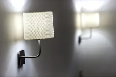 a lamp on a wall with two lights on it at Mr. Charlie Brown in Rome