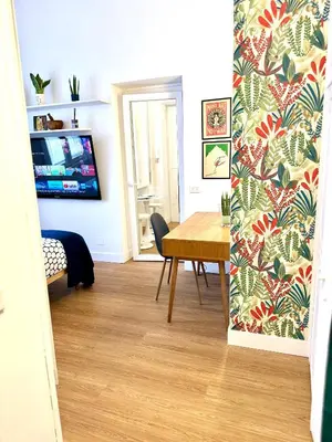 a dining room with a wooden table and a dining room at Angelico 90 in Rome