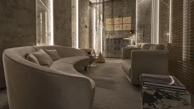 a living room with a couch and two chairs at Fendi Private Suites - Small Luxury Hotels of the World in Rome