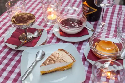 a table with plates of food on a red and white table cloth at Casa in Monti in Rome