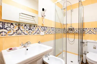 a bathroom with a sink and a shower at Casa in Monti in Rome